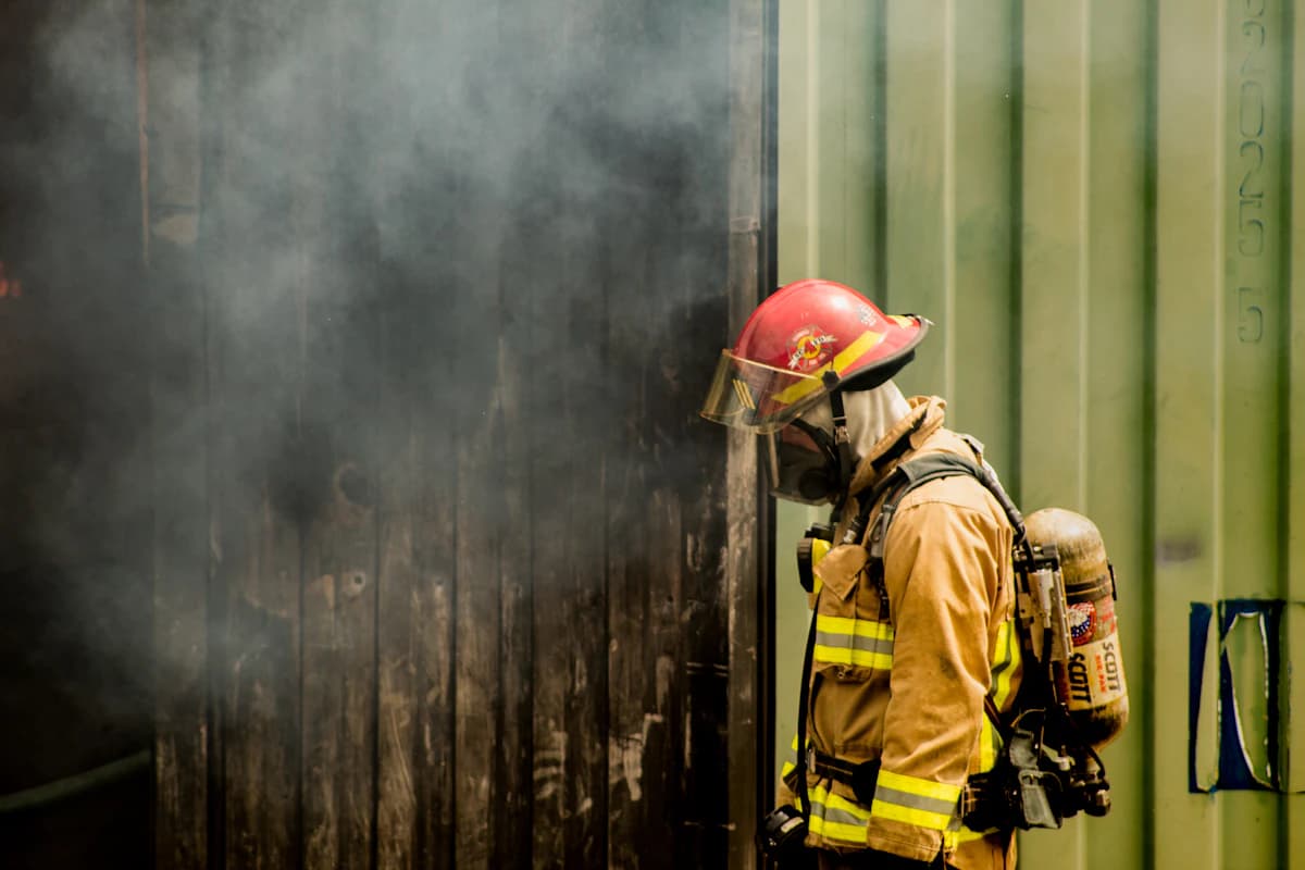 A firefighter in full air pack during live smoke training