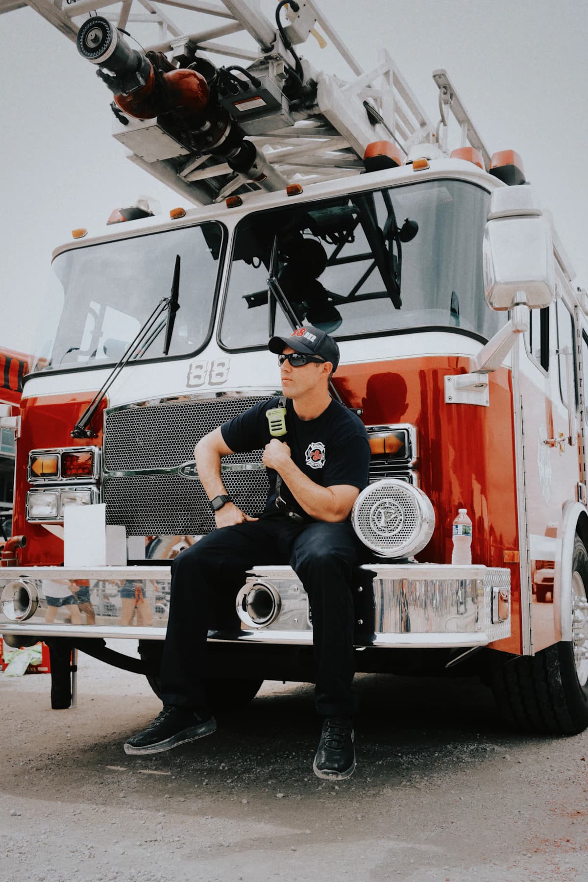A member resting on the front bumper of the ladder truck